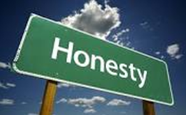 Green road sign that says Honesty